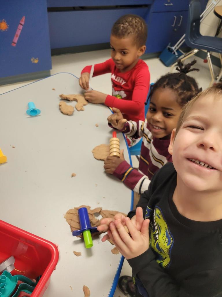 Making  gingerbread men out of PalyDoh