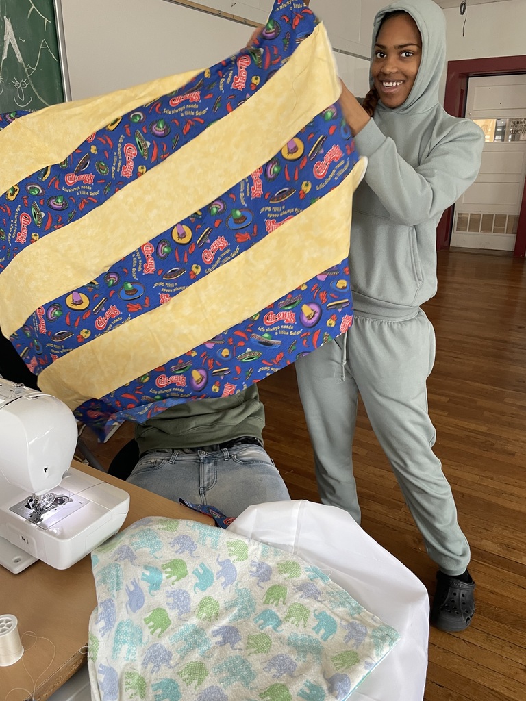 Students in Sewing club working on projects