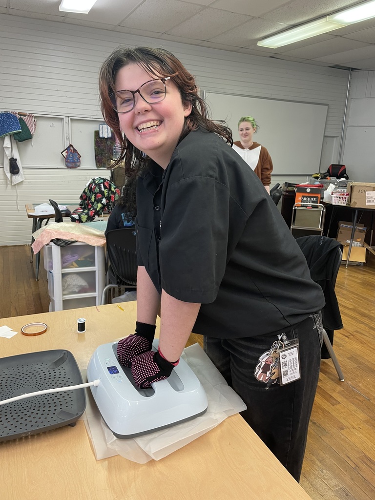 Students in Sewing club working on projects