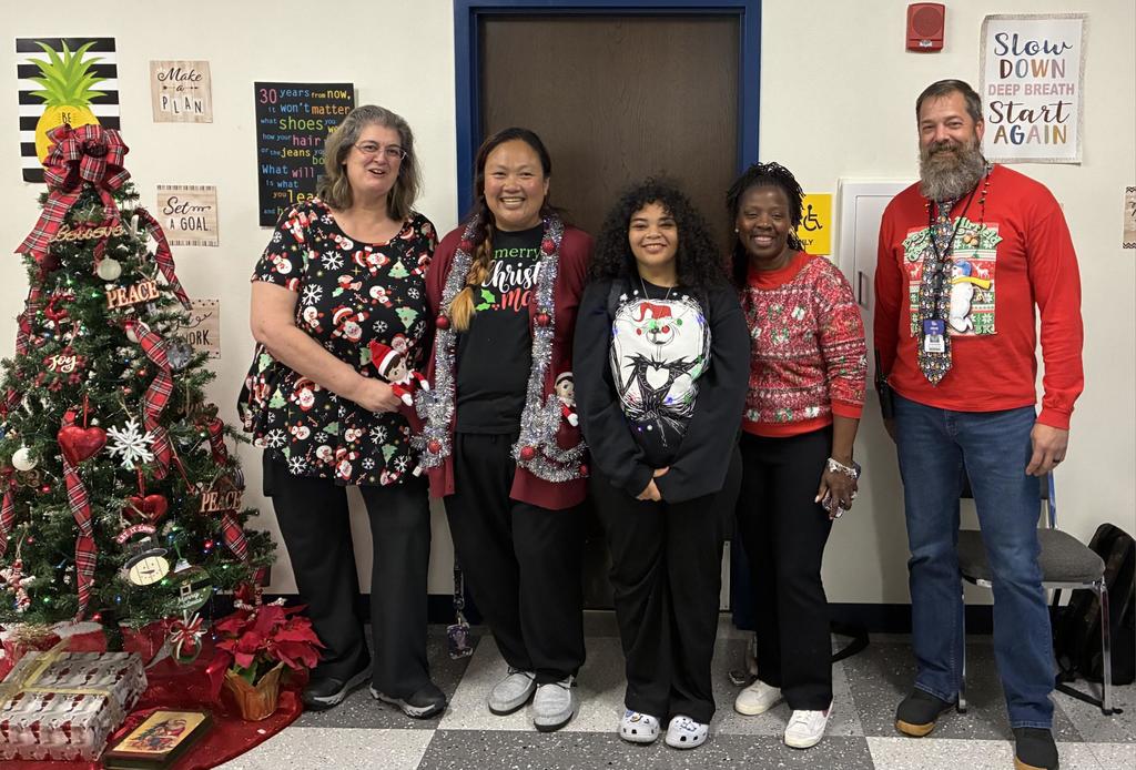 Staff wearing ugly Christmas Sweaters