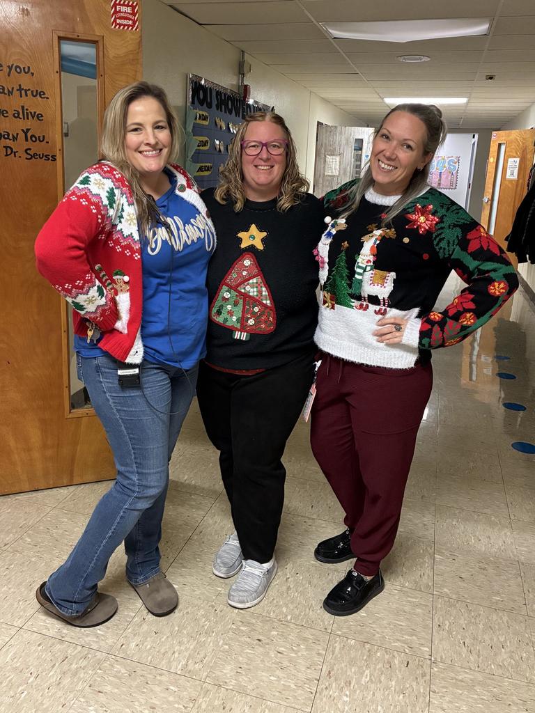 Staff wearing ugly Christmas Sweaters