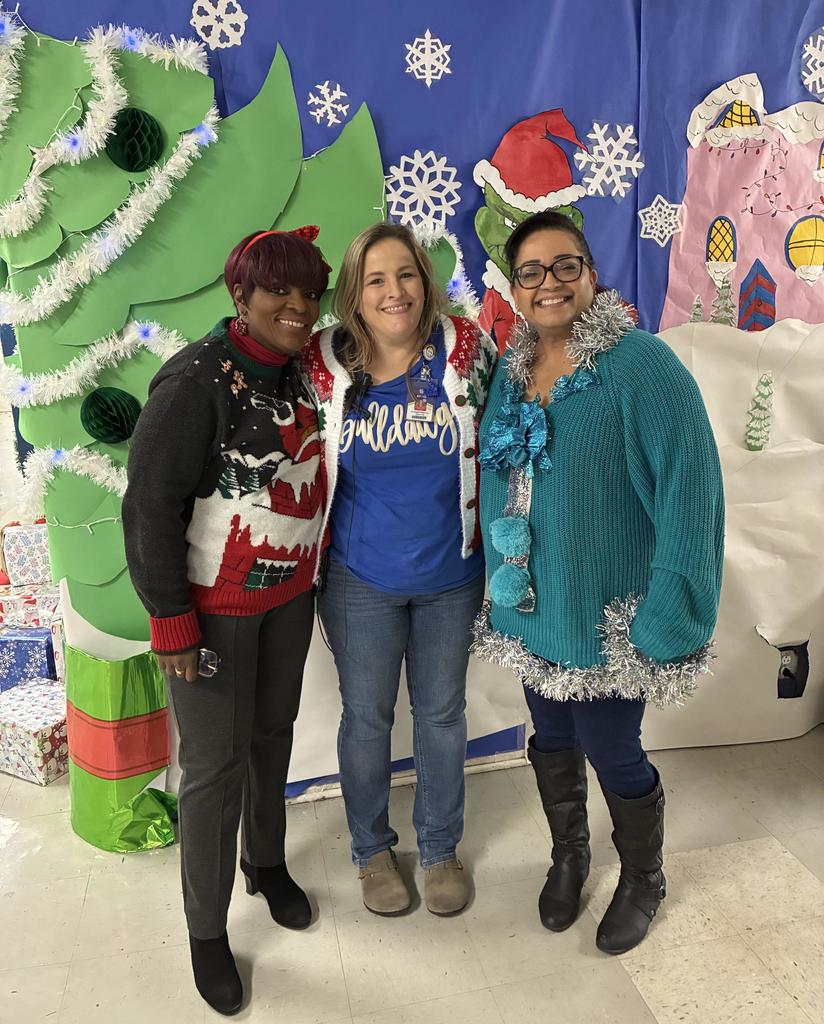 Staff wearing ugly Christmas Sweaters