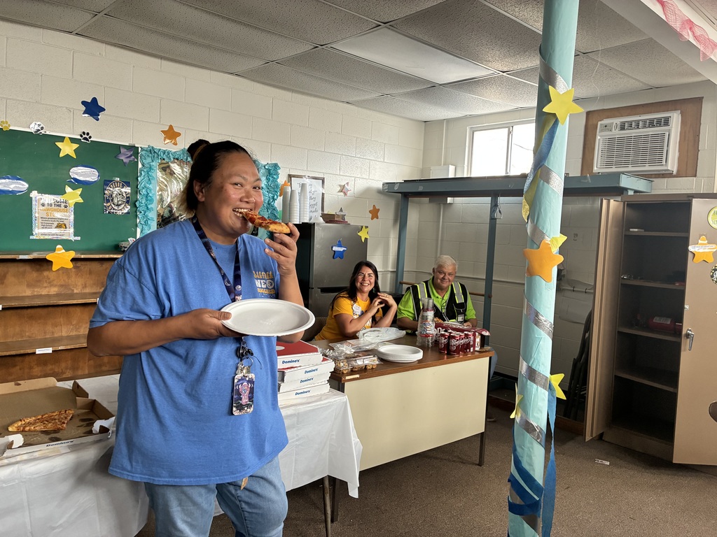 Crossroads Environmental Ambassadors eating pizza