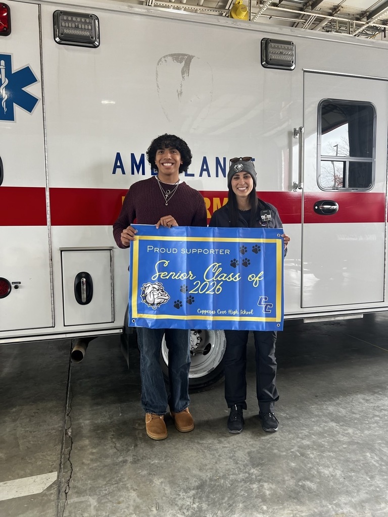 Students presenting a banner to service workers that reads: Proud Supporter - Senior Class of 2026 - Copperas Cove High School