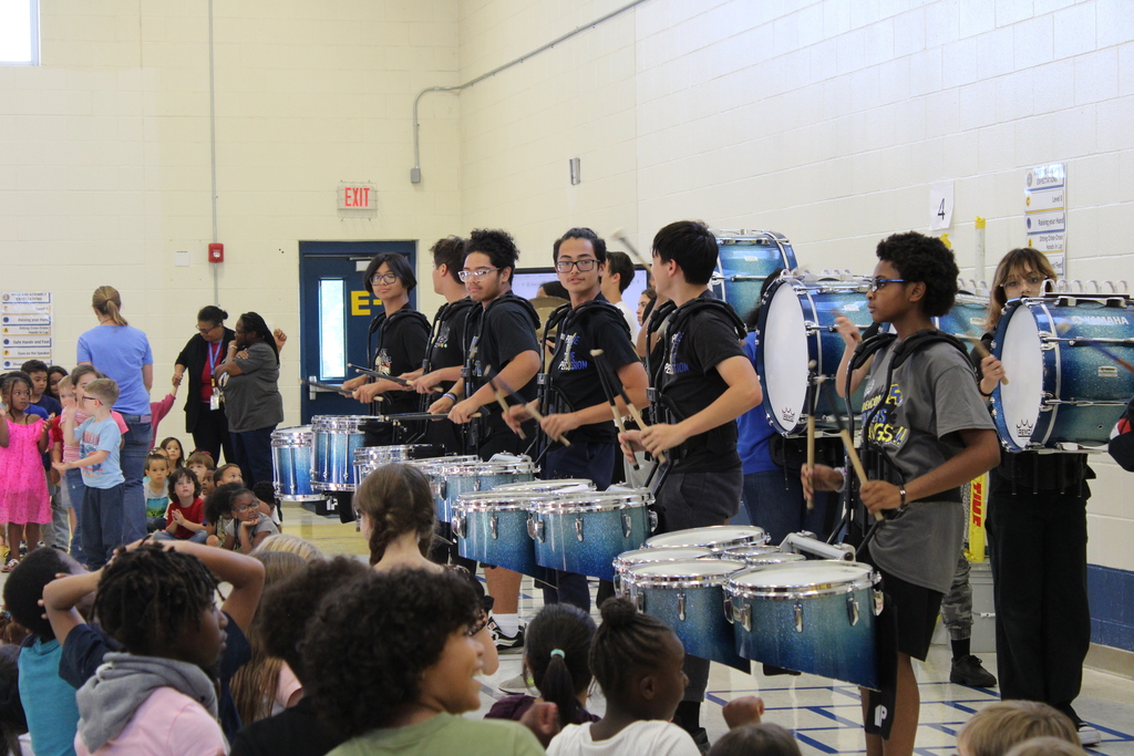 Drumline performing in gym