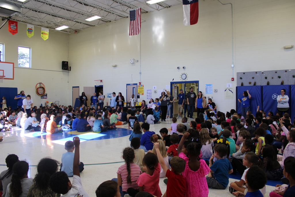 Photo of all students in gym listening to Dr. Sweeney speak