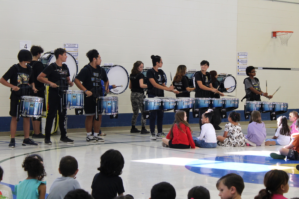 Drumline performing in gym