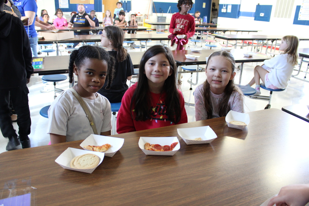 Students pose with treats