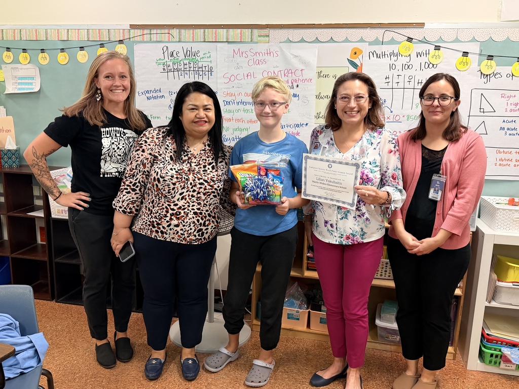 A student and four teachers smiling