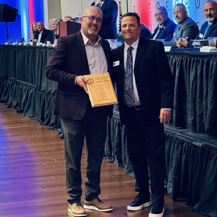 coach getting a plaque 