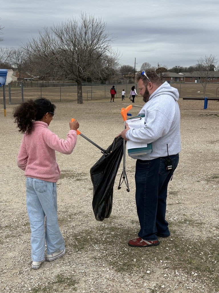 Students cleaning up trash around our campus