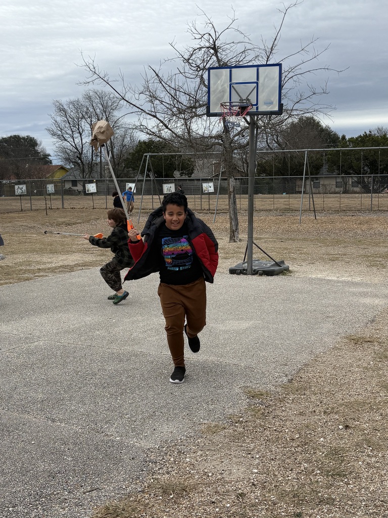 Students cleaning up trash around our campus