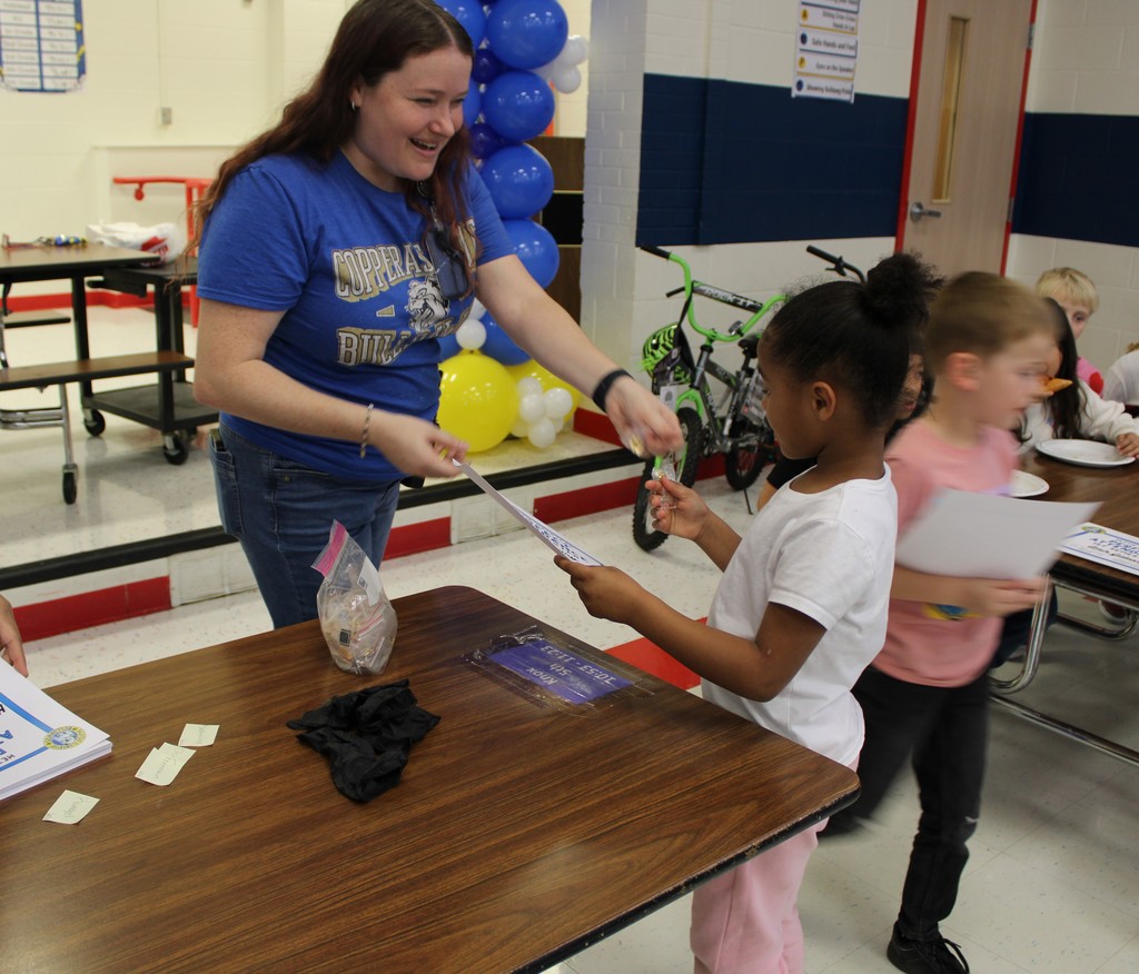 AP Ms. Brown hands out Attendance Certificate and pin to students