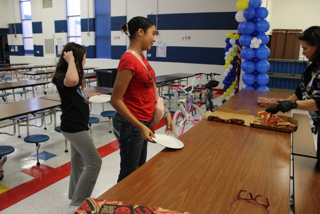 Students in line to receive pizza