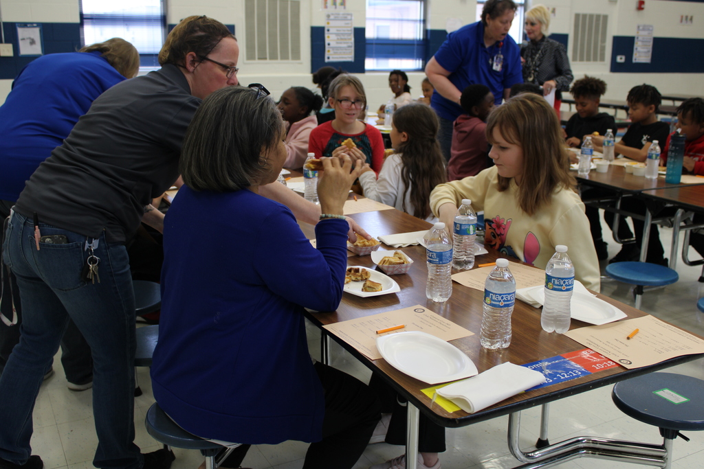 Dr. Sweeney tries food with students