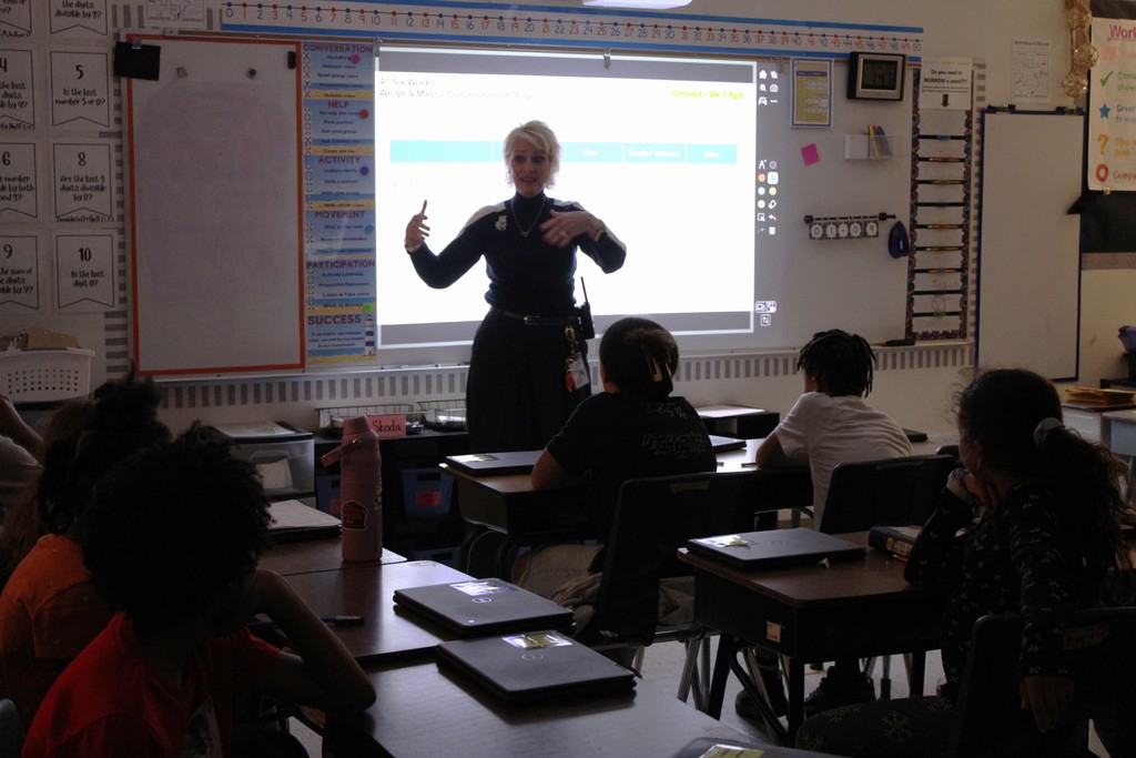 Ms. Bryan talks at front of Ms. Knox Class