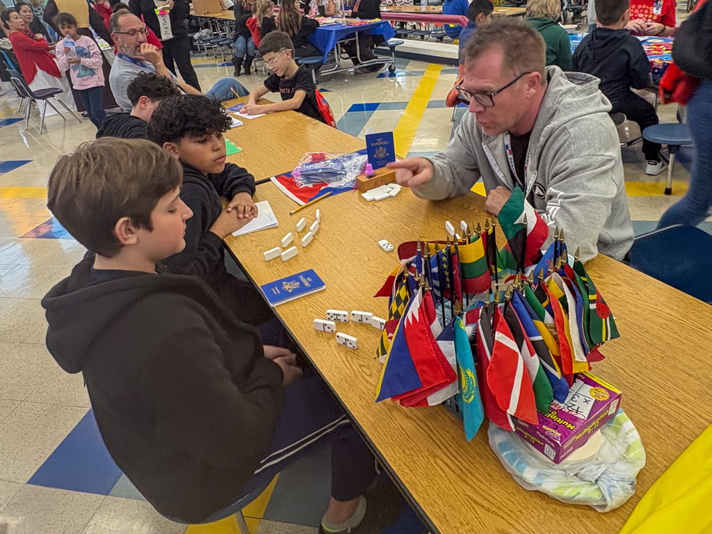 A teacher and students participating in an activity