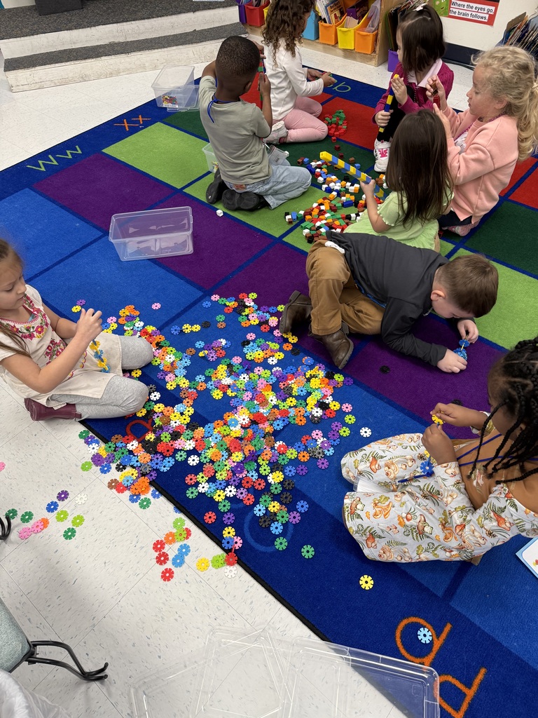 Students making AABB patterns