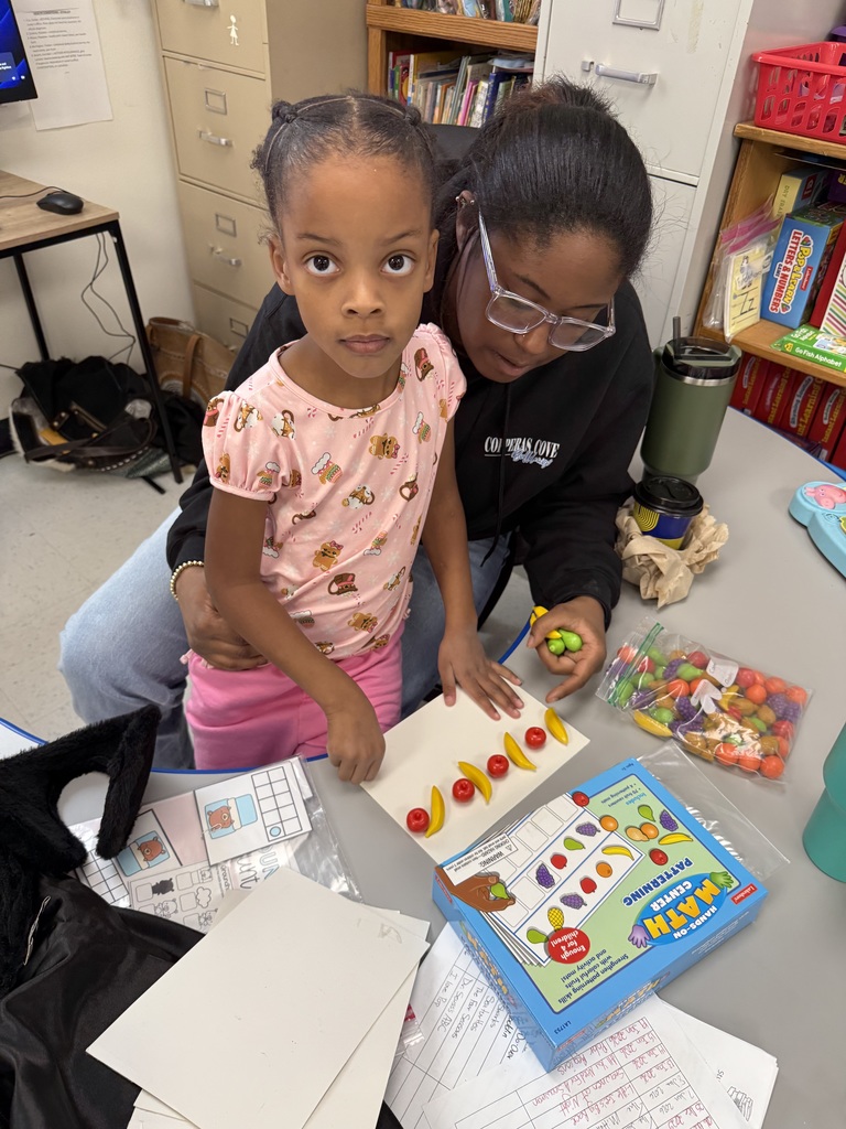 Students making AABB patterns