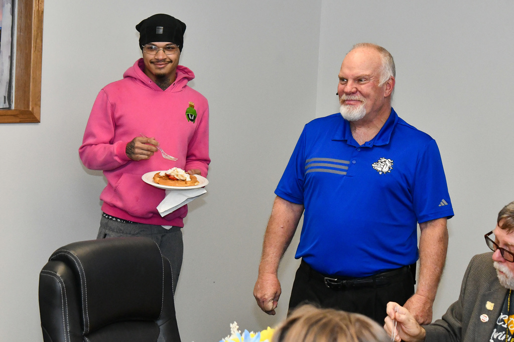 Principal and student simling