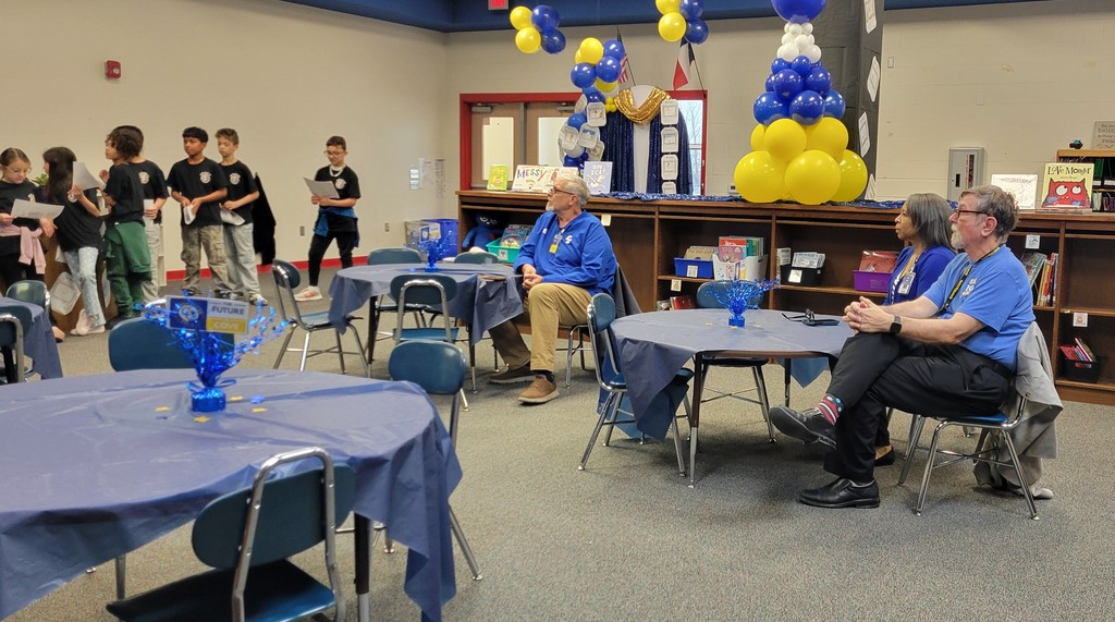 School board members and Dr. Sweeney listen to Student council's presentation