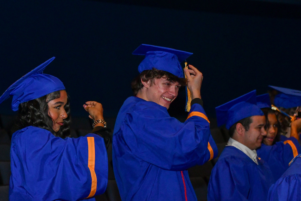 Graduates moving their tassles