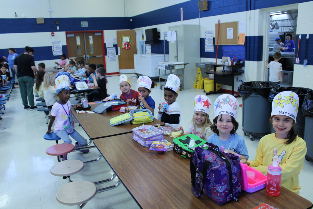 Students at lunch with their 100 day hats