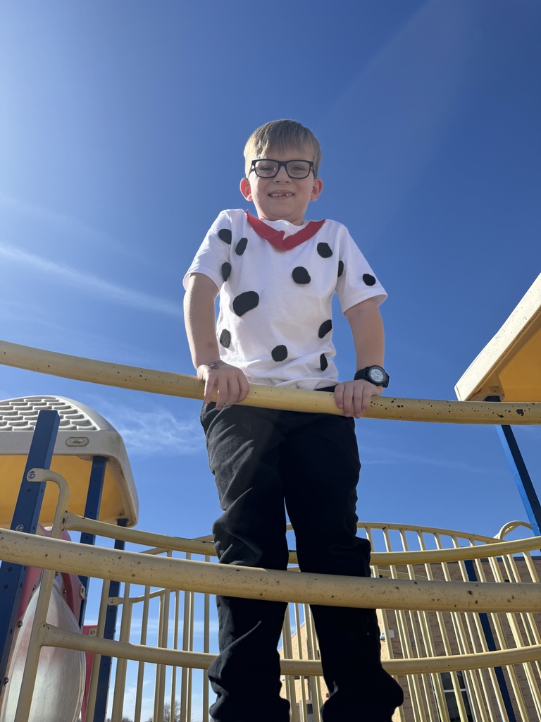 student in dalmation spots poses for picture