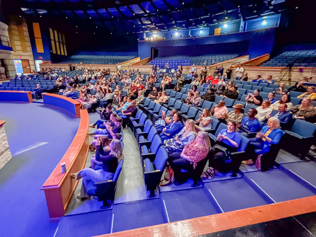 Photo of a crowd in an auditorium
