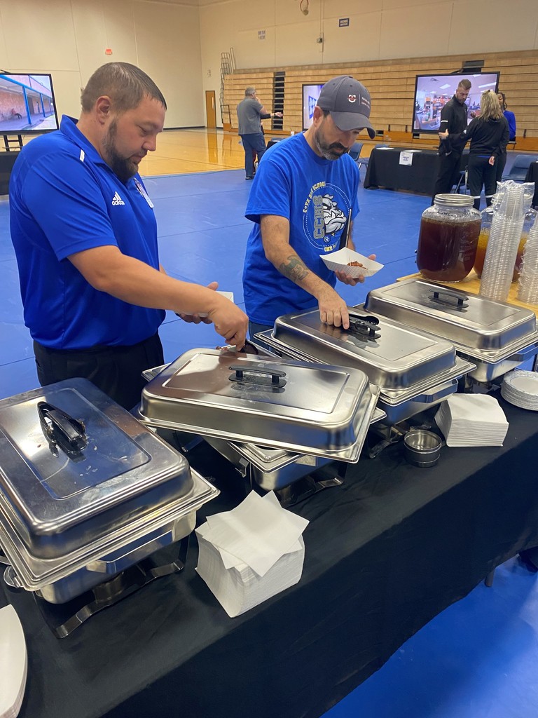 Individuals getting BBQ from the BBQ competition.