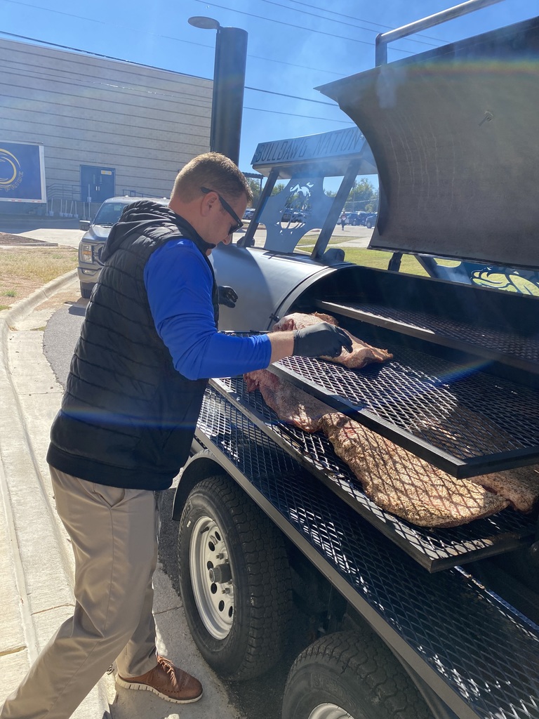 Mr. Robert Turner barbecuing in the pit