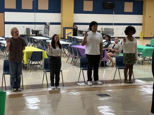 Four students being inducted into the Science National Honor Society