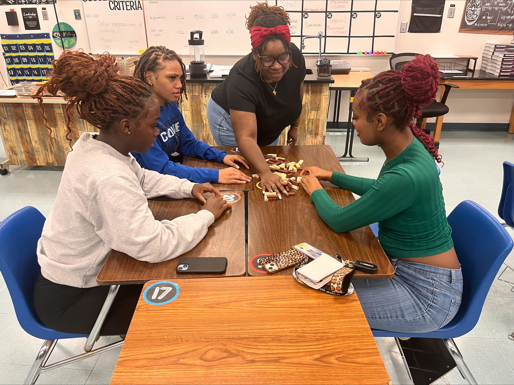 Students participating in a team building round table