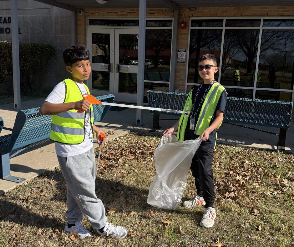 Students in safety vests cleaning our campus