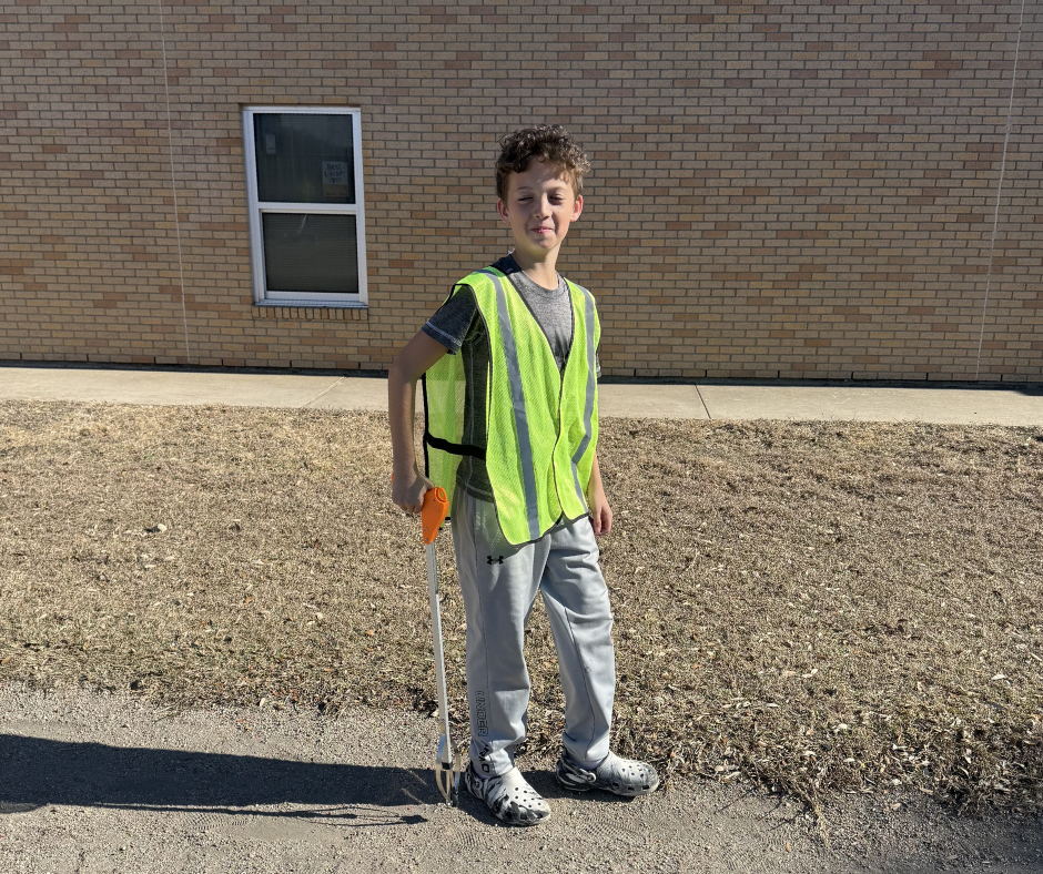 Students in safety vests cleaning our campus