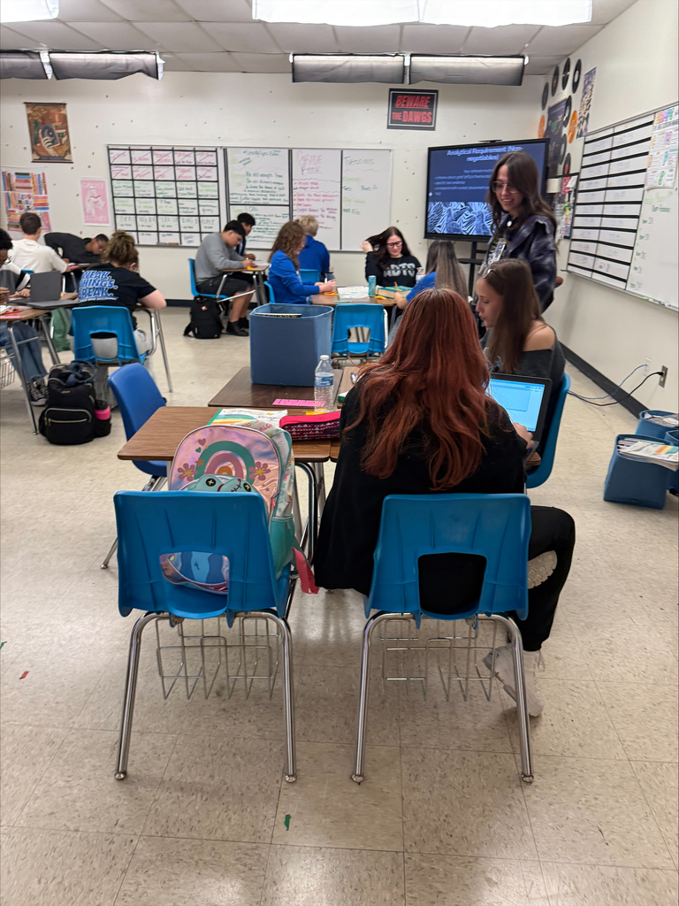 Students working on Escher squares in English class