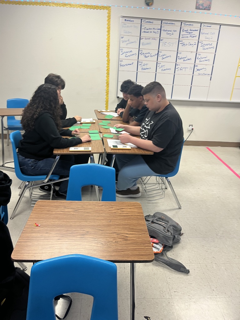 Students participating in a math puzzle for group work. 