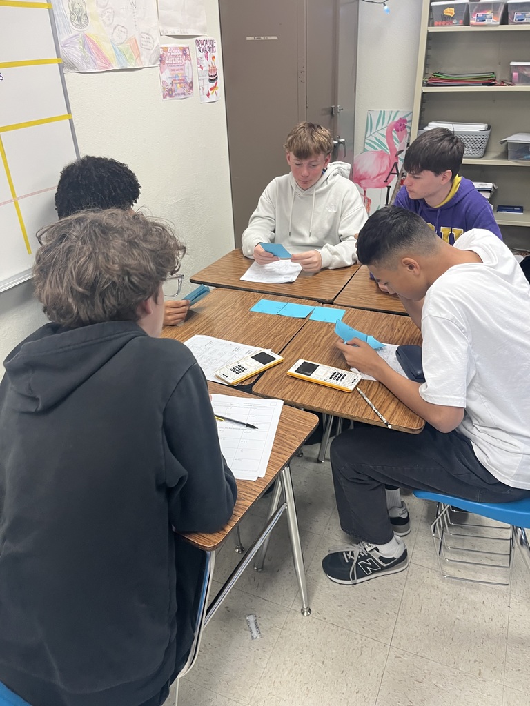 Students participating in a math puzzle for group work. 