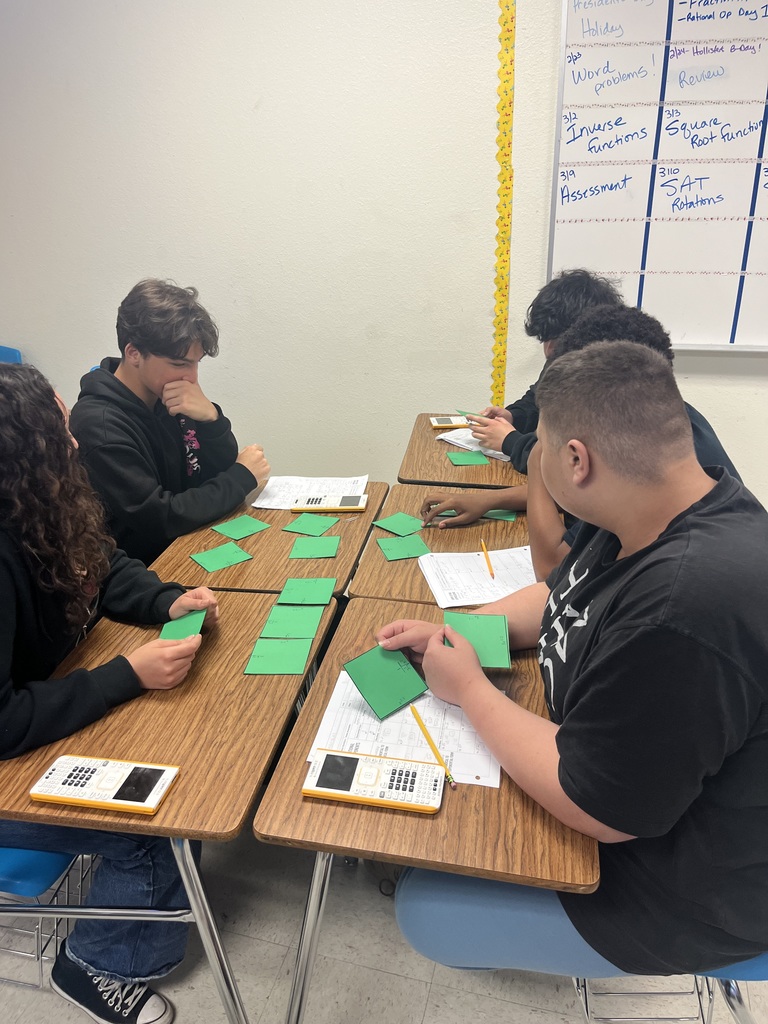 Students participating in a math puzzle for group work. 
