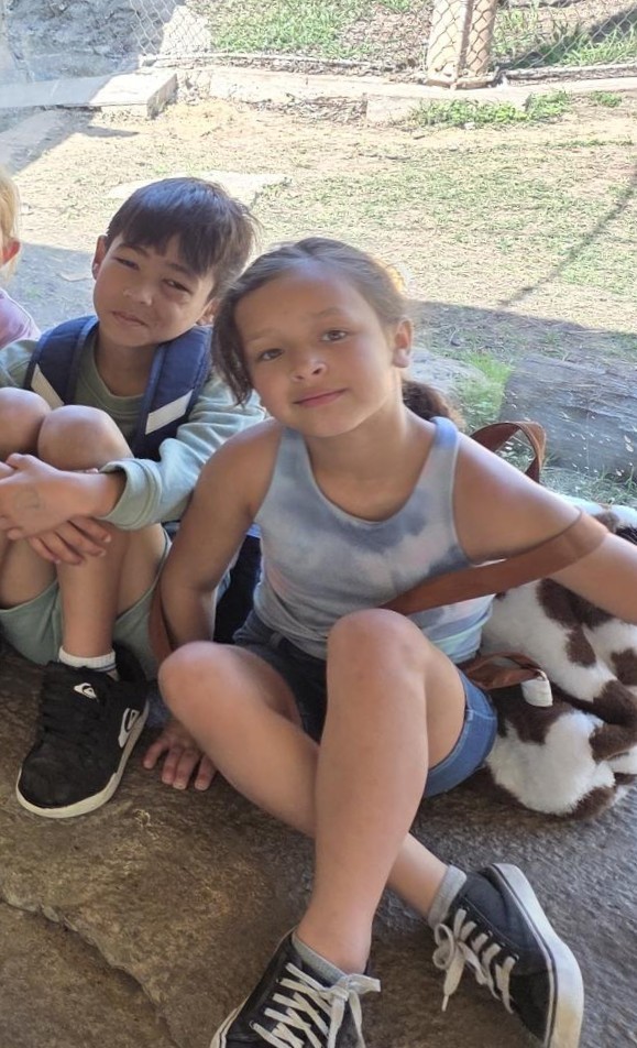 Students pose by animals