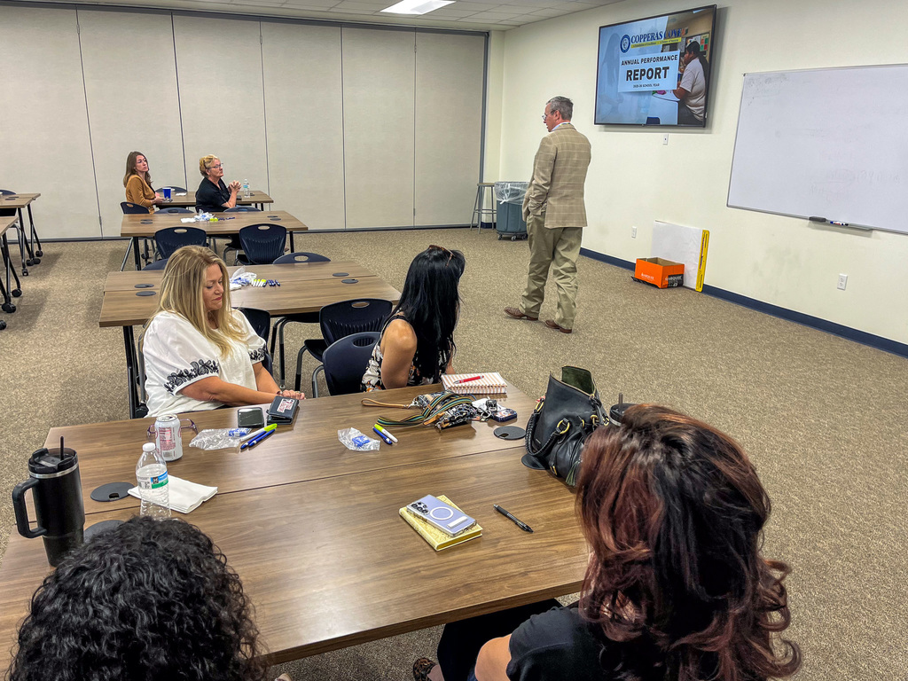 Man speaking to a room of people