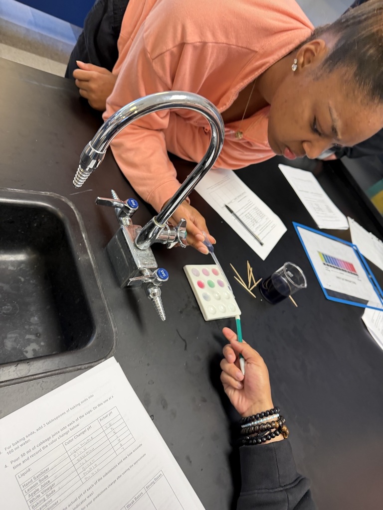 Chemistry students performing an experiment.
