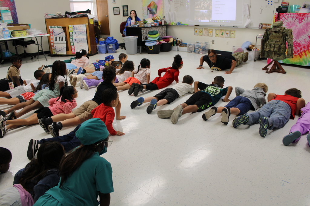 Army presenter leads kinder in push up
