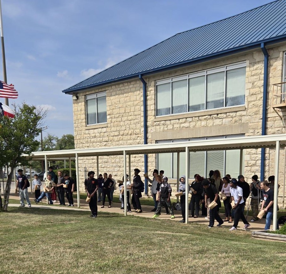 Students lined  up for egg hunt