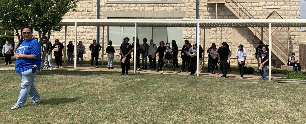 Students lined  up for egg hunt with Ms Garner