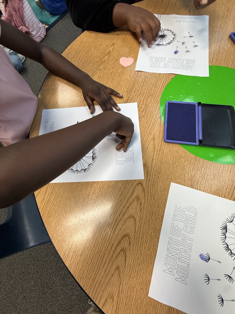 Students stamp their dandelion