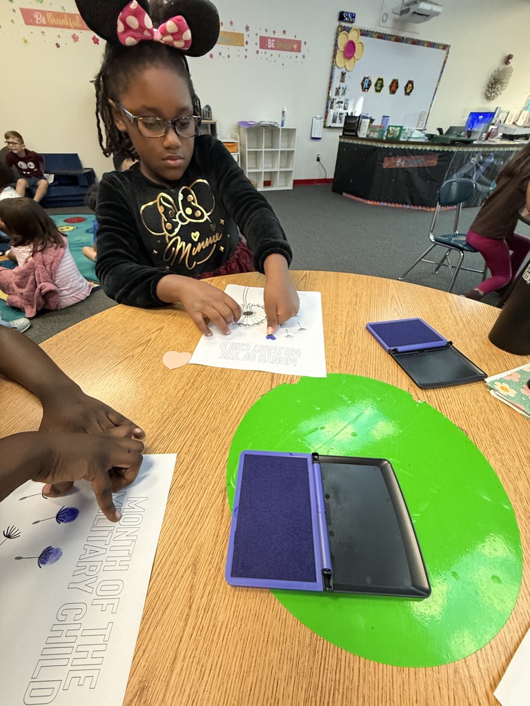 Students stamp their dandelion