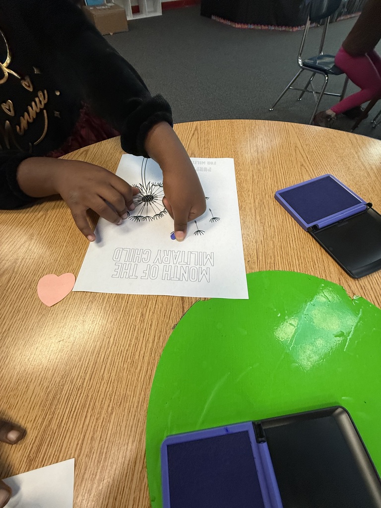 Students stamp their dandelion