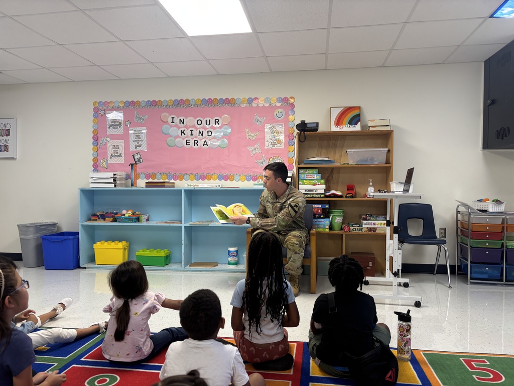 Soldier reading to students