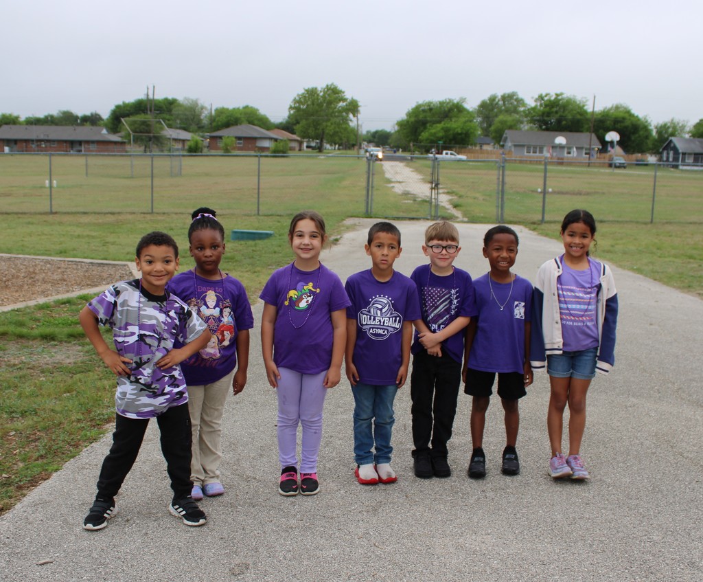 Students pose for purple day